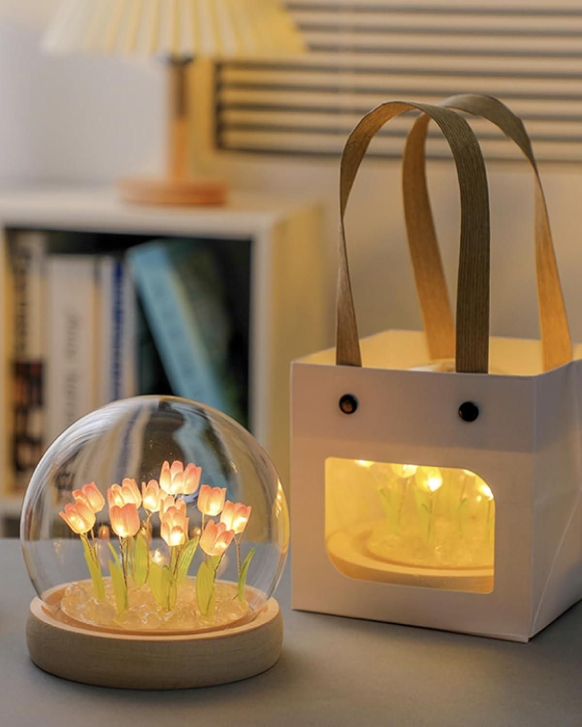 Decorative flower LED lamp with glowing pink tulip lights inside a clear dome and white gift box