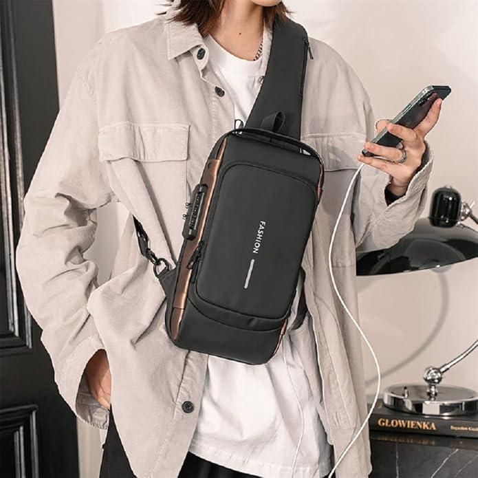 Stylish black sling bag for men and women worn crossbody with multiple compartments and USB charging port