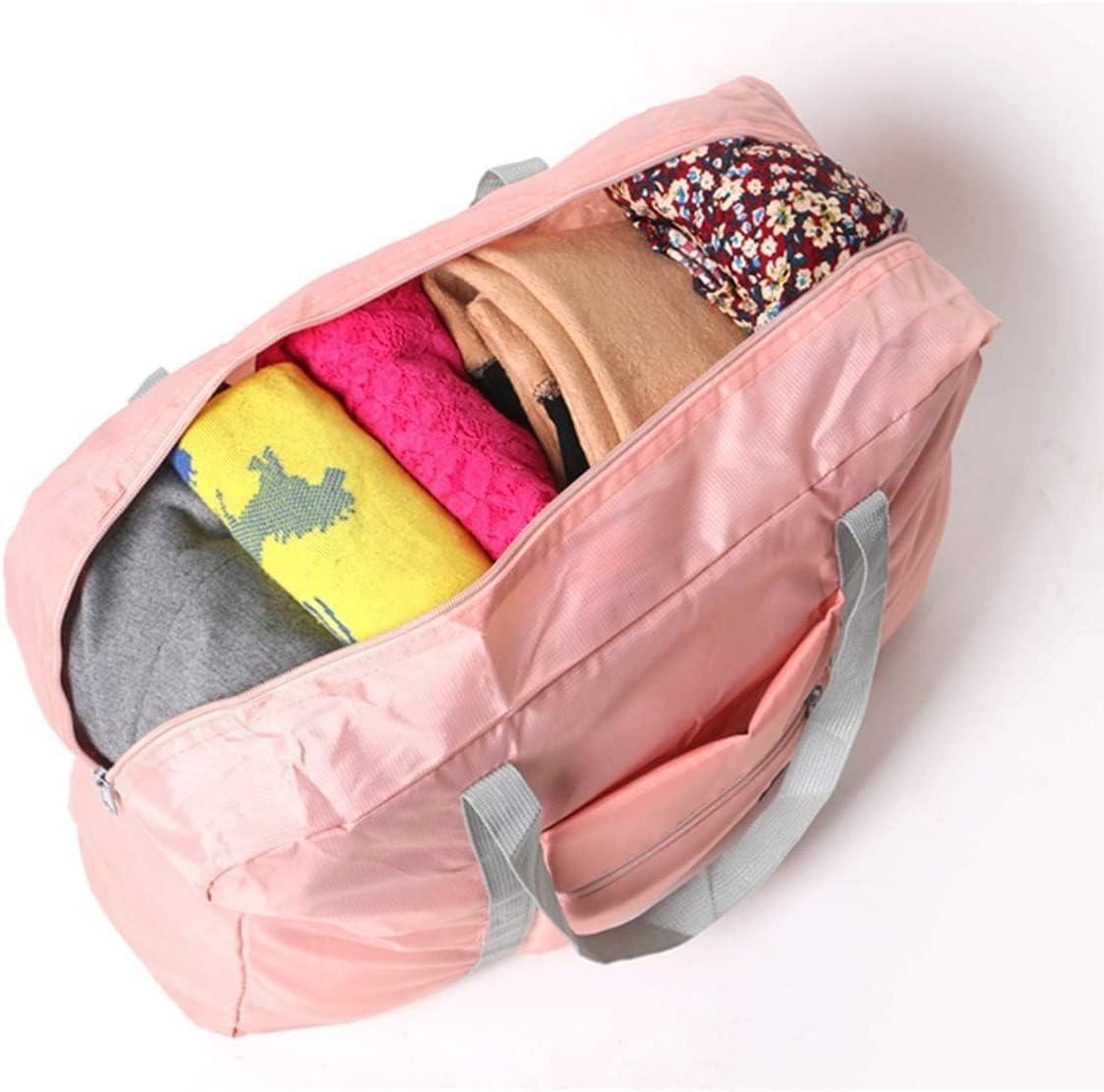 Pink carry on duffel bag for women packed with colorful folded clothes and gray handles
