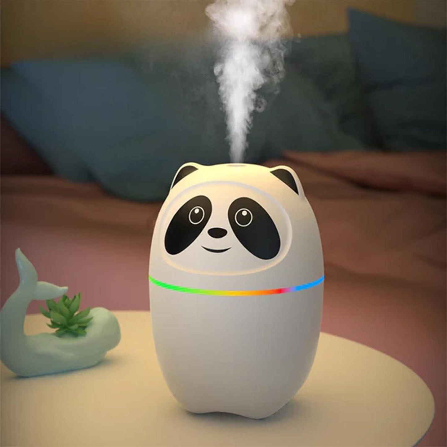 Cute panda-shaped mini cool mist humidifier for room with colorful LED light on a table