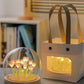 Decorative flower LED lamp with glowing pink tulip lights inside a clear dome and white gift box