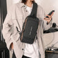Stylish black sling bag for men and women worn crossbody with multiple compartments and USB charging port