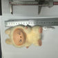 Labubu doll online India fluffy beige toy with bunny ears lying next to ruler showing size