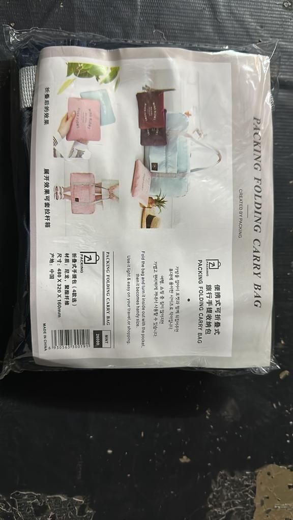 Packaging of portable travel organizer India showing folding carry bag in multiple colors for easy packing