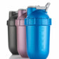Blue protein shaker bottle for gym with measurement markings and secure lid, shown with two other shaker bottles
