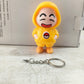 Shinchan cartoon keychain India featuring a yellow-hooded character with a happy expression