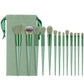 Soft bristle professional makeup brush set with green handles and matching green pouch for easy storage