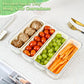 Clear divided snack tray fridge storage container with mushrooms cherry tomatoes grapes and carrot sticks