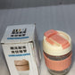 Eco friendly glass tumbler India with peach and cream lid and silicone grip next to its packaging box